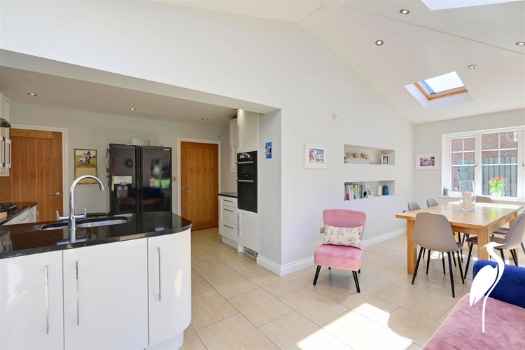 Open Kitchen/Dining and Family Area - Picture 10 of 31
